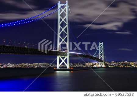 Akashi Kaikyo Bridge from Iwaya Fishing Port Illuminated from dusk Akashi Kaikyo Bridge from Iwaya Fishing Port Illuminated from dusk 69523528