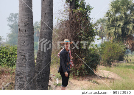 Agriculturist male wear a hat and loincloth across the shoulder Agriculturist male wear a hat and loincloth across the shoulder 69523980