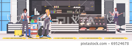 professional cleaners mix race janitors team cleaning and disinfecting floor to prevent coronavirus pandemic 69524678