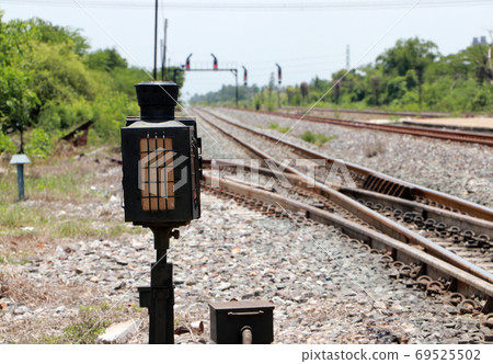 Signal lamp shunting railroad tracks beside the railway. Signal lamp shunting railroad tracks beside the railway. 69525502