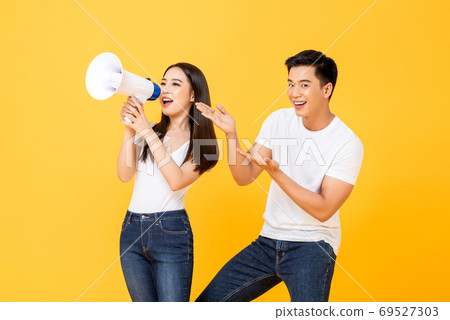 Asian couple making announcement and presenting Asian couple making announcement and presenting 69527303