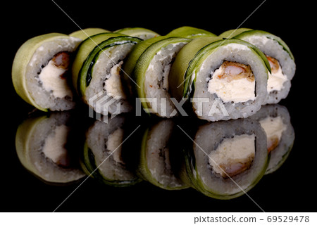 Fresh delicious beautiful sushi rolls on a dark background Fresh delicious beautiful sushi rolls on a dark background 69529478