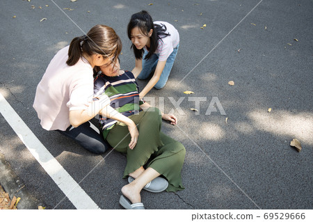 Sick asian senior woman unconsciousness lying on the ground at  outdoor park suffer cardiac syncope,female elderly fell to the floor with congestive heart failure, stroke, unconscious,health problem 69529666