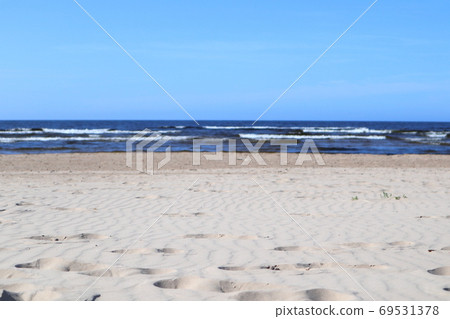 Wavy sand with footsteps on baltic sea coast Wavy sand with footsteps on baltic sea coast 69531378