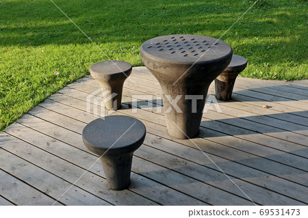 Chess stone tables in city park play chess games Chess stone tables in city park play chess games 69531473