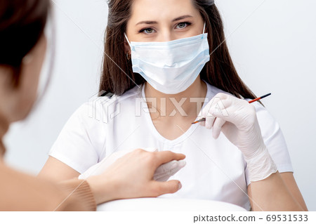 Portrait of manicure master with protective mask Portrait of manicure master with protective mask 69531533