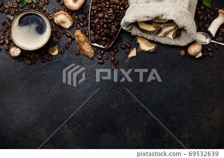 Mushroom Chaga Coffee Superfood Trend-dry and fresh mushrooms and coffee beans on dark background 69532639