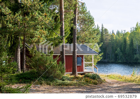 Red wooden finnish cabins cottages pine forest 69532879