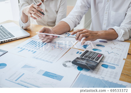 Two business colleague meeting to brainstorm the new project bus Two business colleague meeting to brainstorm the new project bus 69533372