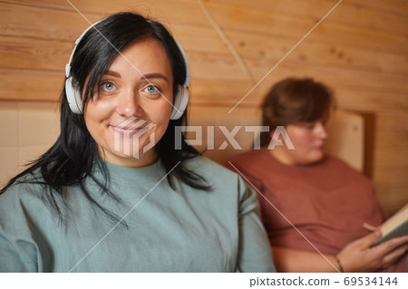 Woman listening to music Woman listening to music 69534144