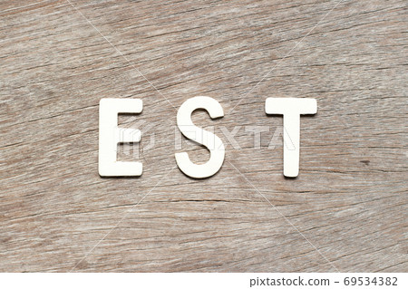 Alphabet letter in word est (abbreviation of established, estimated, eastern time zone, expressed sequence tag) on wood background Alphabet letter in word est (abbreviation of established, estimated, eastern time zone, expressed sequence tag) on wood background 69534382