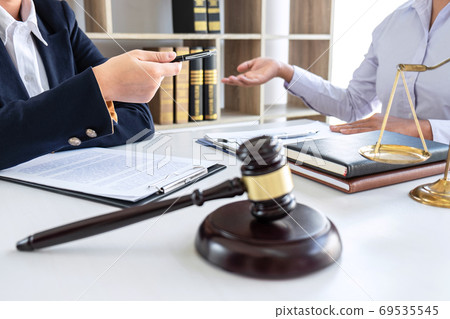 Professional Female lawyer discussing negotiation 69535545