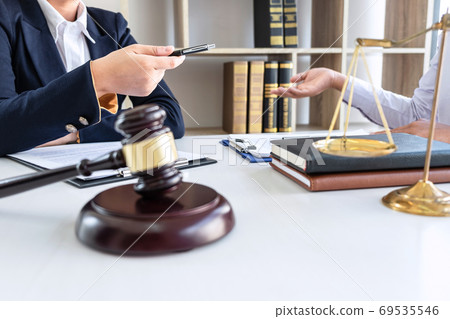 Professional female lawyer or counselor discussing Professional female lawyer or counselor discussing 69535546