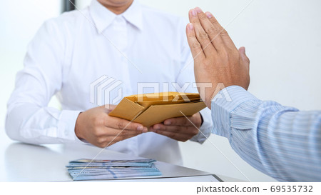 Businessman refusing receive bribe money in the 69535732