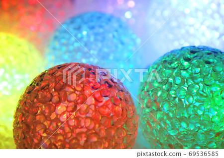 Christmas balls with light. Christmas evening background. 69536585