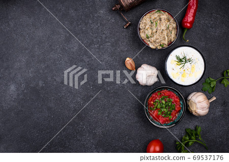 Baba ganoush, tzatziki and tomato ezme Baba ganoush, tzatziki and tomato ezme 69537176