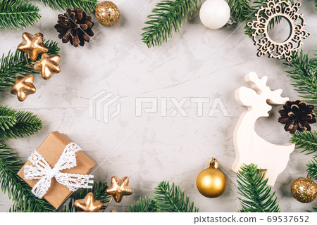 Christmas composition of fir tree branches and decorations. Christmas composition of fir tree branches and decorations. 69537652