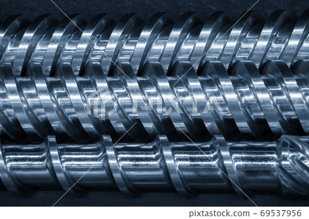 Close-up scene of injection machine screw spare parts. Close-up scene of injection machine screw spare parts. 69537956