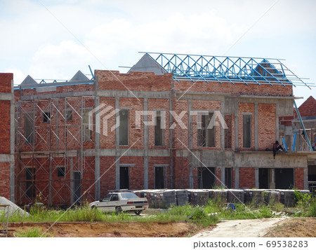 SEREMBAN, MALAYSIA -APRIL 08, 2020: New double story luxury terrace house under construction in Malaysia. Designed by an architect with a modern and contemporary style. SEREMBAN, MALAYSIA -APRIL 08, 2020: New double story luxury terrace house under construction in Malaysia. Designed by an architect with a modern and contemporary style. 69538283