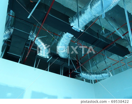KUALA LUMPUR, MALAYSIA - AUGUST 31, 2019: Air-condition and ventilation duct under construction at the construction site. Distributing cool air and control the room's temperature.   69538422