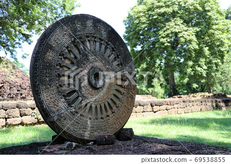 Stone carving of the wheel of the dharma. in archaeological site Stone carving of the wheel of the dharma. in archaeological site 69538855