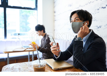 A man working at a cafe A man working at a cafe 69539495
