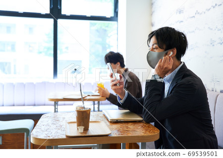A man working at a cafe A man working at a cafe 69539501
