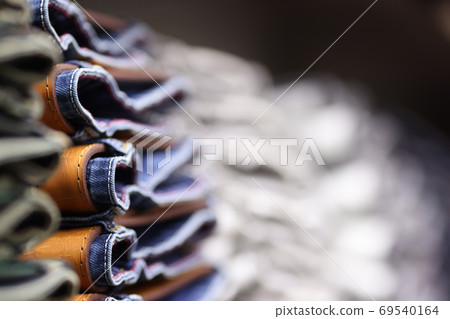 Showcase with jeans neatly stacked. Showcase with jeans neatly stacked. 69540164
