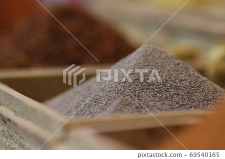 Slide of black ground pepper close up. Slide of black ground pepper close up. 69540165