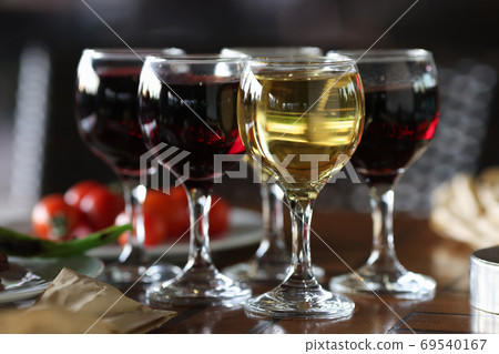 Four glasses of wine are on festive table. Four glasses of wine are on festive table. 69540167