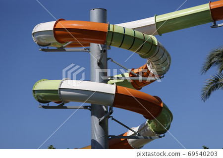 Multi-colored plastic screw construction against sky. Multi-colored plastic screw construction against sky. 69540203