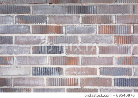 Old vintage colored brick wall texture background 69540976