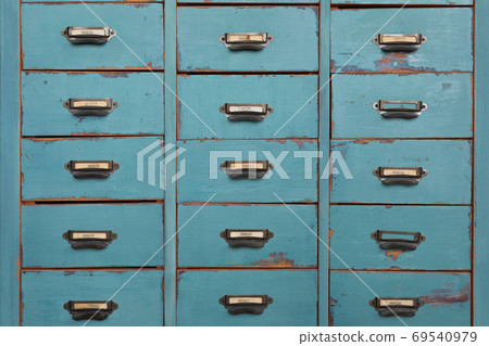 Old turquoise and brown colored wooden cabinet Old turquoise and brown colored wooden cabinet 69540979