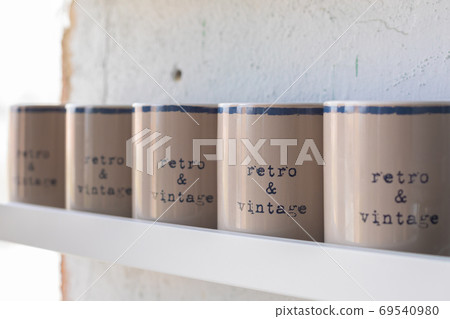 Vintage beige tea and coffee mugs on wooden white Vintage beige tea and coffee mugs on wooden white 69540980