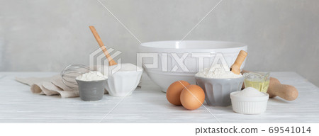Ingredients for bakery butter flour, milk, oil, eggs, sugar, kitchen accessories Ingredients for bakery butter flour, milk, oil, eggs, sugar, kitchen accessories 69541014