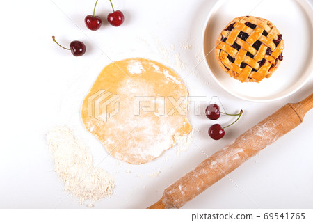 Cooking homemade mini cherry pie - autumn food concept Cooking homemade mini cherry pie - autumn food concept 69541765