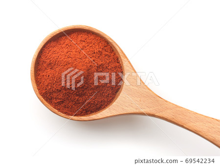 Top view of of red paprika powder in wooden spoon 69542234