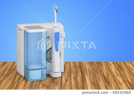 Water flosser, dental oral irrigator on the wooden table. 3D ren Water flosser, dental oral irrigator on the wooden table. 3D ren 69542960