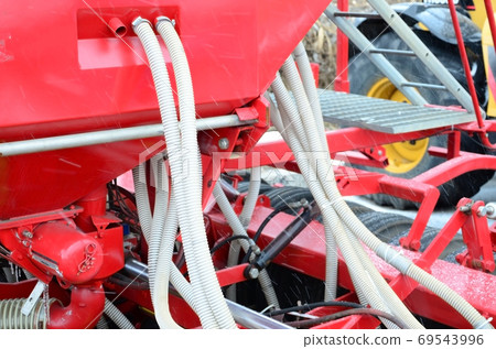 Springs and tubes are arranged in a row. A row of seeder. Heavy Springs and tubes are arranged in a row. A row of seeder. Heavy 69543996