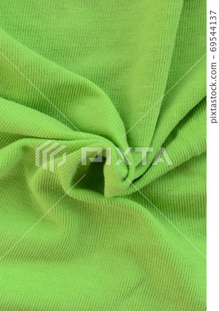 The texture of the fabric is bright green. Material for making s 69544137