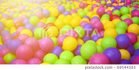 Many colorful plastic balls in a kids' ballpit at a playground. Many colorful plastic balls in a kids' ballpit at a playground. 69544383