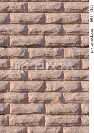 Texture of a relief concrete wall of beige color Texture of a relief concrete wall of beige color 69544395