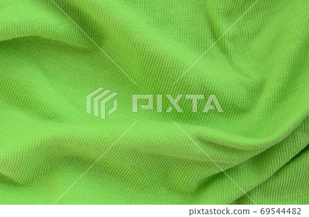 The texture of the fabric is bright green. Material for making s 69544482