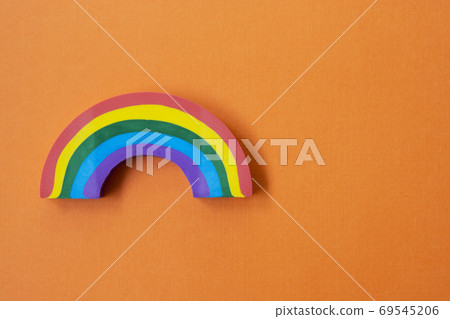 Rainbow object, over orange background. LGBT Rainbow object, over orange background. LGBT 69545206