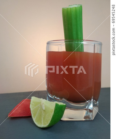 True Bloody Mary Cocktail celery stick lemon and tomato slice. True Bloody Mary Cocktail celery stick lemon and tomato slice. 69545248