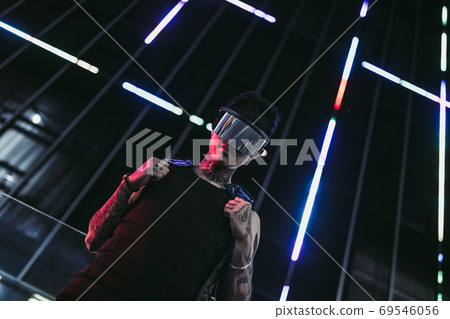 Strict style of the future. Man with gadgets of the future. Cyberpunk 2020 Strict style of the future. Man with gadgets of the future. Cyberpunk 2020 69546056