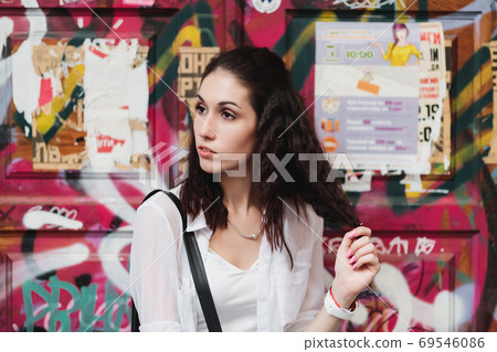 female portrait on graffiti 69546086