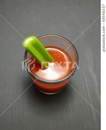 Bloody Mary or The Vampire Cocktail (sangrita cocktail) and celery stick. top view Bloody Mary or The Vampire Cocktail (sangrita cocktail) and celery stick. top view 69548337