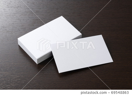 Plain business card on a wooden background Plain business card on a wooden background 69548863