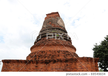 Small stupa beside the main pagoda in the ruins of ancient remains at Wat Worachet temple Small stupa beside the main pagoda in the ruins of ancient remains at Wat Worachet temple 69549834